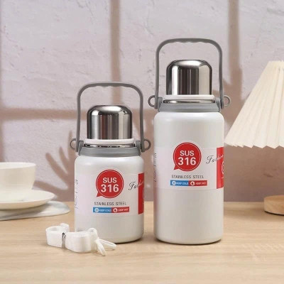 Bình Giữ Nhiệt Cup Inox 316 Nắp Kèm Cốc Có Tấm Lọc Trà, Tay Cầm Tiện Lợi - giao mầu ngẫu nhiên